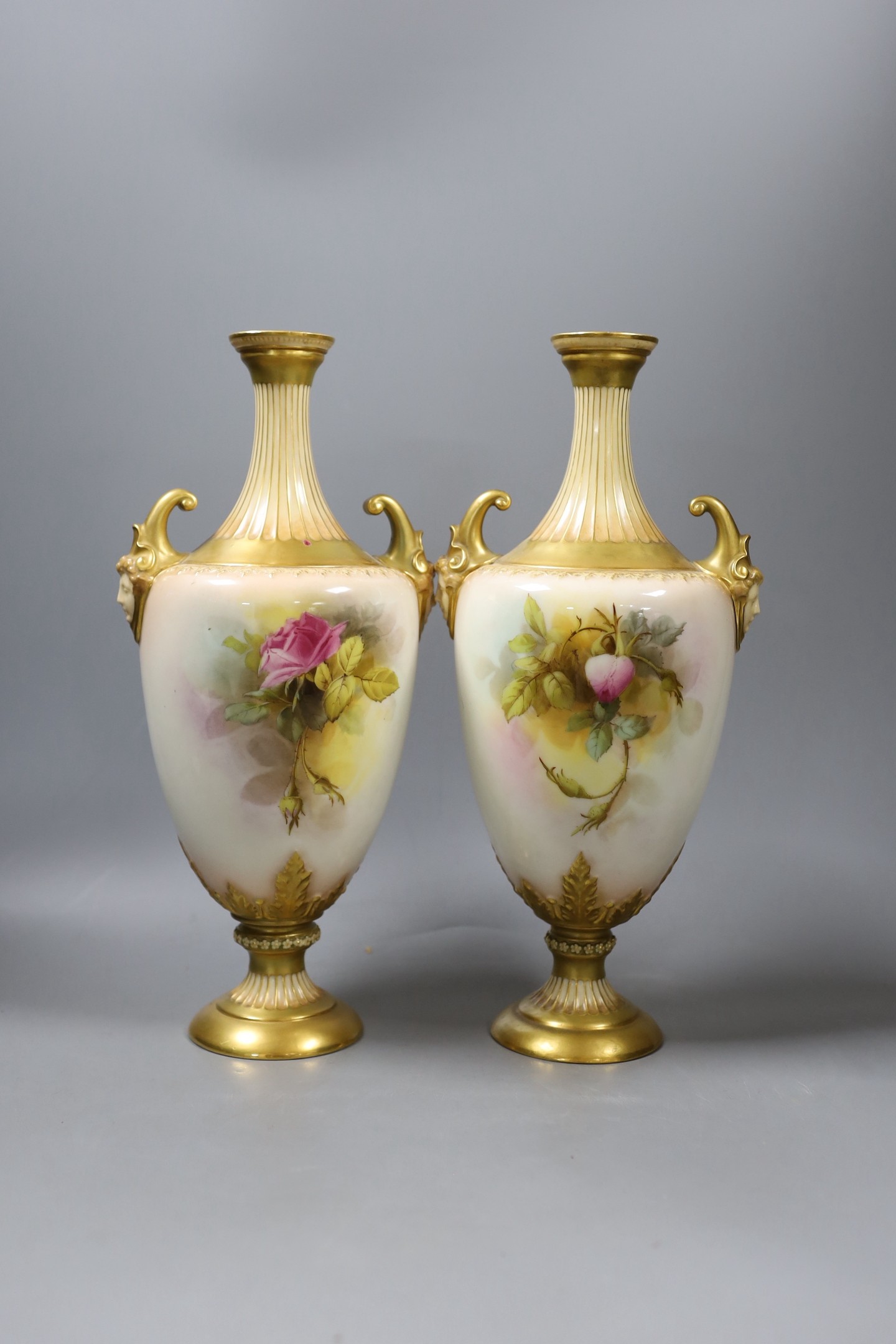 A pair of Royal Worcester rose painted vases, signed W. Hart - 34cm tall